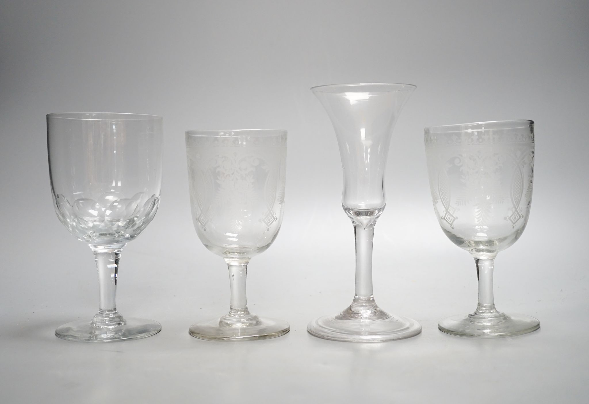 A mid 18th century trumpet bowled wine glass and three other glasses, 18cm